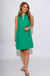 Green sleeveless mini dress with white contrast piping V-neck collar and front patch pockets, women's boutique dress at Gaudie & Co