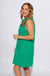 Green sleeveless mini dress with white contrast piping V-neck collar and front patch pockets, women's boutique dress at Gaudie & Co