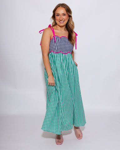 Colorblock gingham midi dress with black gingham bodice, green gingham skirt, and hot pink contrast waist detail, women's boutique dress at Gaudie & Co