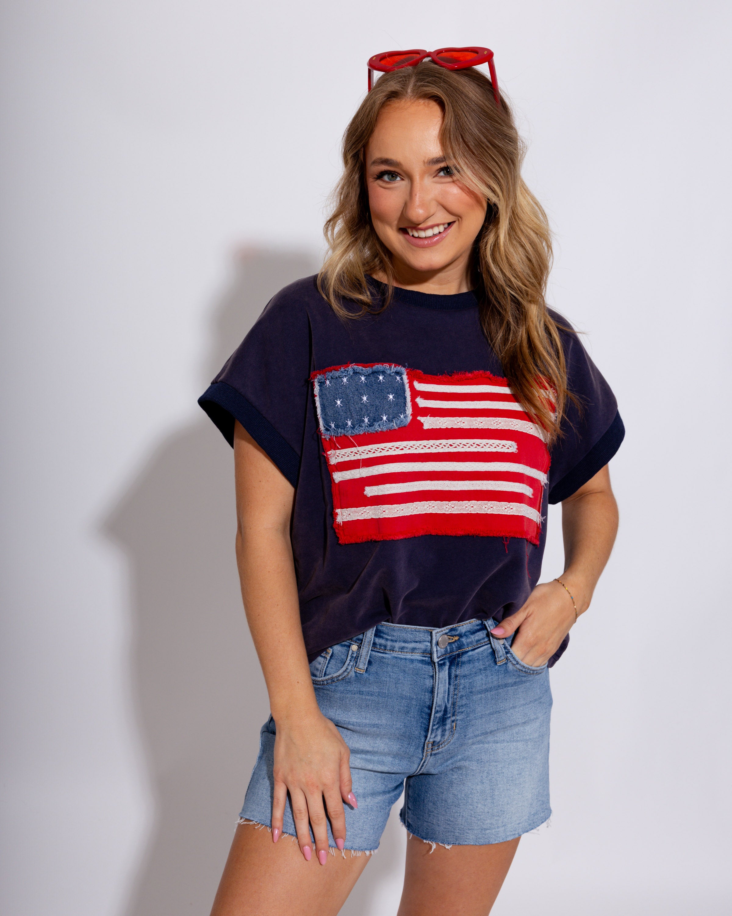 Washed drop shoulder top with frayed American flag patch, women's patriotic casual boutique top at Gaudie & Co