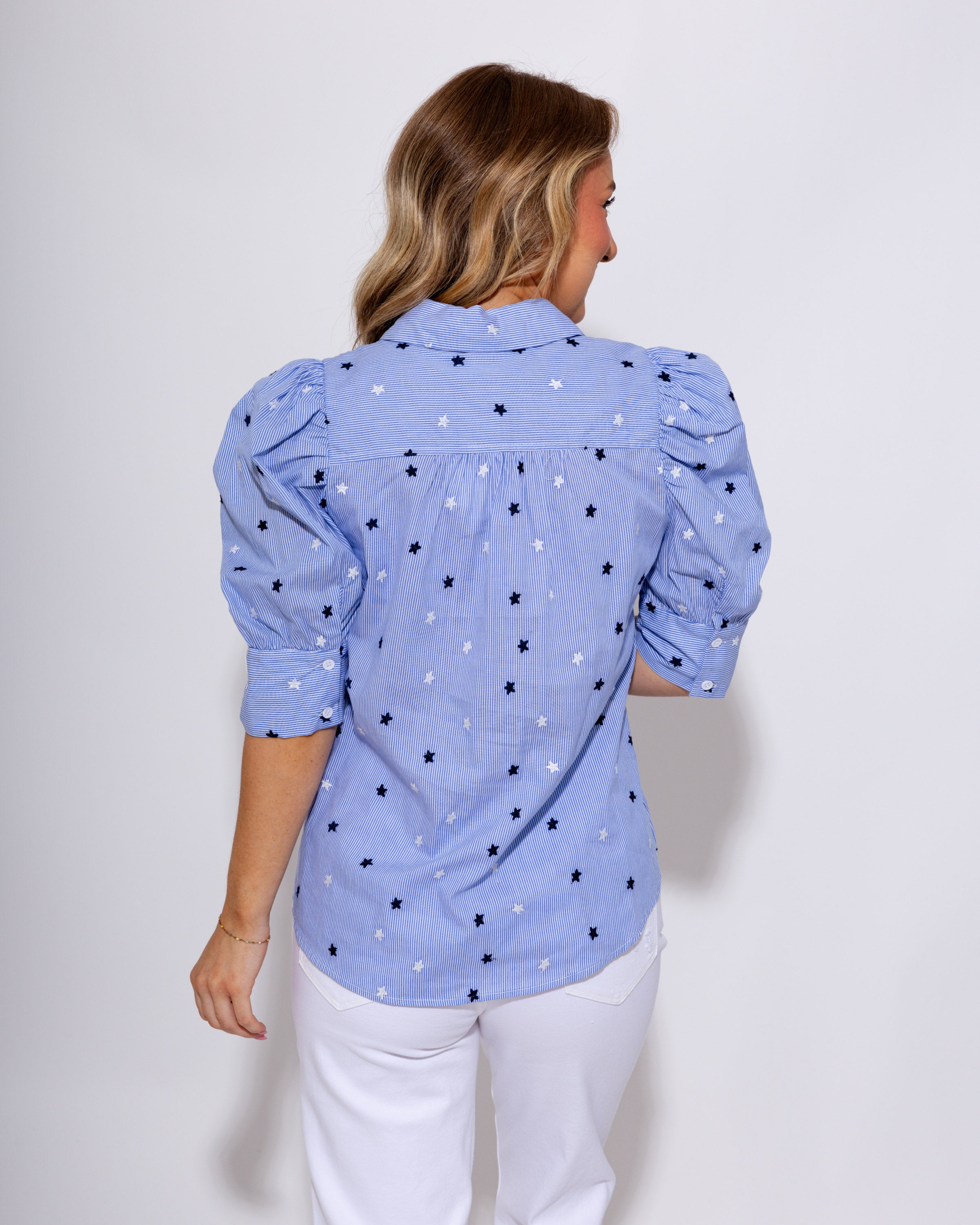 Blue striped puff sleeve button-up blouse with star embroidery and ruffle cuffs, women's boutique top at Gaudie & Co